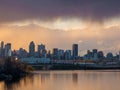 Montreal, Quebec, Canada, May 2020. Montreal over river at sunset with city lights and urban buildings Royalty Free Stock Photo