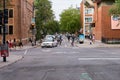 Montreal, Quebec, Canada, September 1, 2018: pedestrians, cars, cyclists cross the intersection of 3495 Rue University 659 Rue
