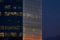 Montreal, Quebec, Canada, September 26, 2018: Sunset clouds reflected in the windows of a modern office building. end of workday Royalty Free Stock Photo