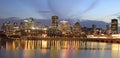 Montreal skyline at dusk with lights reflections on St Lawrence River in Quebec Royalty Free Stock Photo