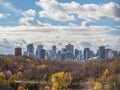 Montreal skyline, with the iconic buildings of the Montreal CBD business skyscrapers seen from Jean Drapeau park and its forest Royalty Free Stock Photo