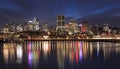 Montreal skyline illuminated at night with nice reflections in Saint Lawrence River Royalty Free Stock Photo