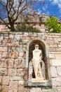 Montserrat sculpture in stone wall, near Barcelona, Spain