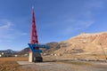 Monument in abandoned soviet russian mining village of pyramiden svalbard norway with last coal car