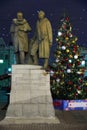 Monument in Chamberlain lane on the Christmas tree background at night, Moscow, Russia