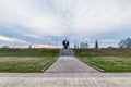 A monument commemorating the victims of the camp, work of sculptor Miodrag Popovic. In the b