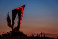 Monument of the Dead Motorcyclist in shape of an eagle in Varna, Bulgaria against the evening sky