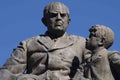 Monument of Domingo Fautino Sarmiento seated with two children in the Plaza 25 May made in bronze