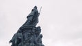 Monument of Empress on background cloudy sky. Action. Bottom view of majestic monument of russian Empress. Monument of