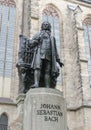 Monument of famous German composer Johann Sebastian Bach against St Thomas Church Thomaskirche in Leipzig, Germany