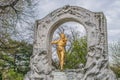 monument featuring a bronze statue of legendary musician, Johann Strauss II, gilded in gold, at stadtpark in vienna, austria