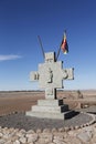 Monument with flag of Aymara people at the Valle de la Luna or Moon Valley