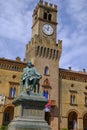 Monument of Giuseppe Verdi closeup on the square of Giuseppe Verdi across the building of theater in Busseto, Italy