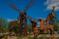 Monument Holguin, Cuba: statue of don Quixote on horse, Sancho Panza and mill