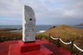 Monument on Hornos Island. In the background Tourists at the Albatross. Cape Horn. Chile Royalty Free Stock Photo