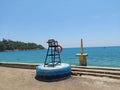 The monument of indian freedom fighter and a watch chair with rescue apparatus at corbyns cove beach of andaman