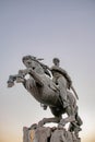 Monument of man with horse. Sculpture depicting a rider and his war horse in a rapid burst of rush at the enemy. Royalty Free Stock Photo