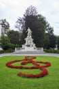 Monument in memory of Wolfang Amadeus Mozart with floral decoration in the form of treble clef in the Burggarten, Vienna, Austria