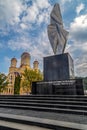 Monument and Orthodox church in Resita, Romania.