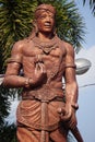 The monument of Panji Asmoro Bangun in Kediri. The statue holding lotus flower and keris keris is one of traditional Javanese wea