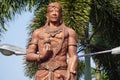 The monument of Panji Asmoro Bangun in Kediri. The statue holding lotus flower and keris keris is one of traditional Javanese wea