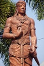 The monument of Panji Asmoro Bangun in Kediri. The statue holding lotus flower and keris keris is one of traditional Javanese wea