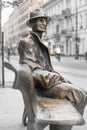 Monument on Piotrkowska Street in Lodz - A man sits on a bench