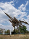 Monument plane fighter in flight against the blue sky Royalty Free Stock Photo