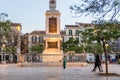 Monument in Plaza de Merced, People in Face Masks, Covid Royalty Free Stock Photo