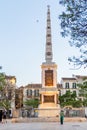 Monument in Plaza de Merced, People in Face Masks, Covid Royalty Free Stock Photo