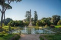 Monument with pond in green park Villa Torlonia in Rome