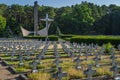Monument and rows of graves. Military cemetery for fallen soldiers from 1st Polish Army