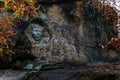 Monument sandstone rock relief Sphinx created by Vaclav Levy between Libechov and Zelizy, Cliff carvings carved in pine forest,