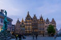 Monument sculpture with historic buildings at the grotemarkt of antwerp city, Antwerpen, Belgium, April 23, 2019