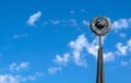 A monument of the Soviet era hammer and sickle on the background of blue sky Royalty Free Stock Photo