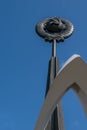 A monument of the Soviet era hammer and sickle on the background of blue sky Royalty Free Stock Photo