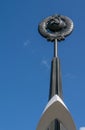 A monument of the Soviet era hammer and sickle on the background of blue sky Royalty Free Stock Photo