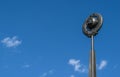 A monument of the Soviet era hammer and sickle on the background of blue sky Royalty Free Stock Photo