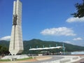 Monument of soyang dame with green mountains and bluse sky in the background