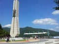 Monument of soyang dame with green mountains and bluse sky in the background