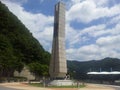 Monument of soyang dame with green mountains and bluse sky in the background