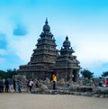 A monument surrounded by tourists in Mahabalipuram, tamilnadu.Known for its monuments and temples built by the Pallava dynasty