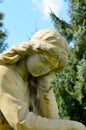 Monument to an angel in a garden Royalty Free Stock Photo