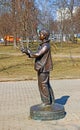 Monument to boy photographer with a camera from which a bird flies