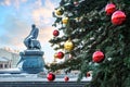 Monument to Dostoevsky at the Lenin Library in Moscow and Christmas balls on the tree