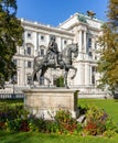Monument to emperor Franz Stephan I in Burggarten park with Hofburg palace at background, Vienna, Austria
