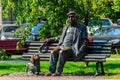 Monument to famous ukrainian actor Mykola Yakovchenko sitting on the bench with his dog near his native theatre in Kiev, Ukraine