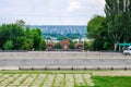 Monument to the Fighters of the Revolution on the background of the Old Town. Lugansk, Ukraine