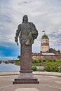Monument to General Admiral Fyodor Apraksin with Vyborg Castle in Vyborg, Russia