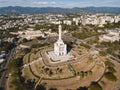 Monument to the Heroes of the Restoration surrounded by buildings in the Dominican Republic